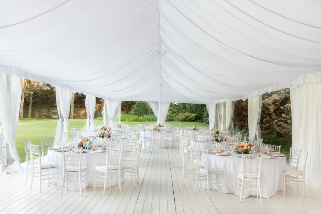 Outdoor wedding reception in tent
